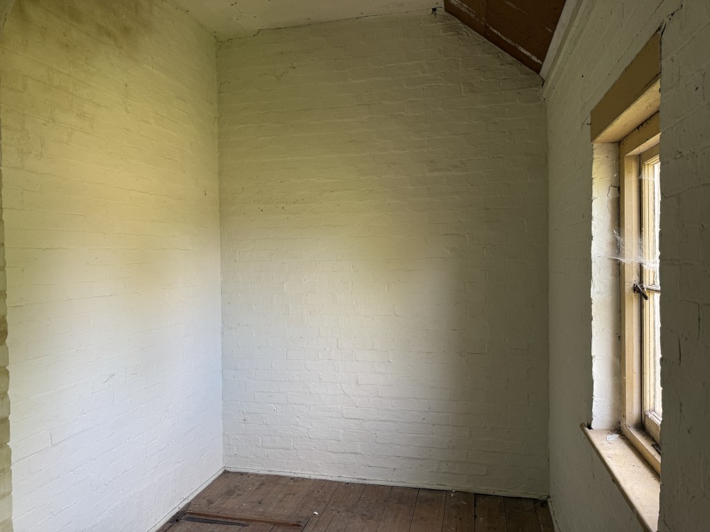 Lot: 170 - FORMER METHODIST CHAPEL WITH PLANNING FOR CONVERSION TO A RESIDENTIAL DWELLING ON PLOT OF 0.39 ACRES - First floor room with wooden floor and chimney breast